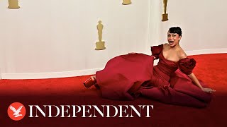 Moment Liza Koshy falls in gown on 2024 Oscars red carpet