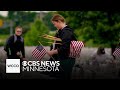 Family places flags at Fort Snelling as Memorial Day tradition