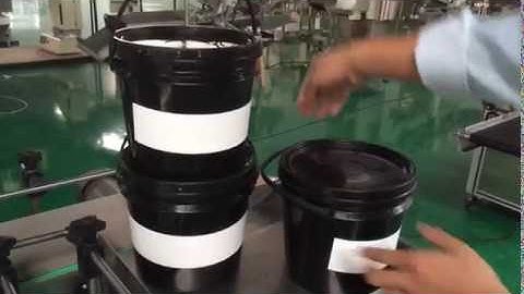 Automatic bucket labeling machines model ALM-21200B ( large conveyor belt and handler up devices)