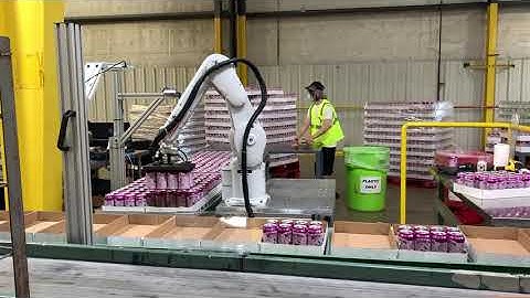 Beverage variety packing robot arm on a production line