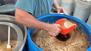 Separating over 450 pounds of honey from our wax cappings.