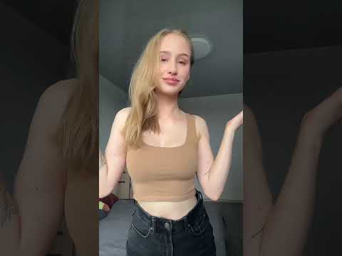 cute blonde smiling and dancing.