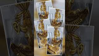 This gold-tone Hinduism Lord Ganesha deity statue figurine sculpture is a symbol of Hinduism's.