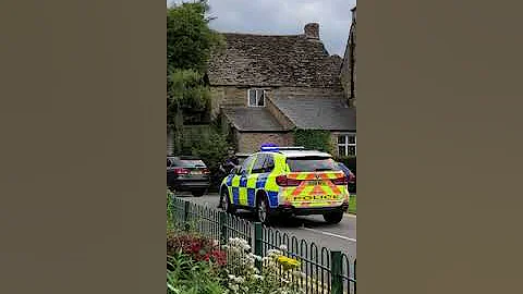 Armed police swoop on car. In lovely village of Ki...