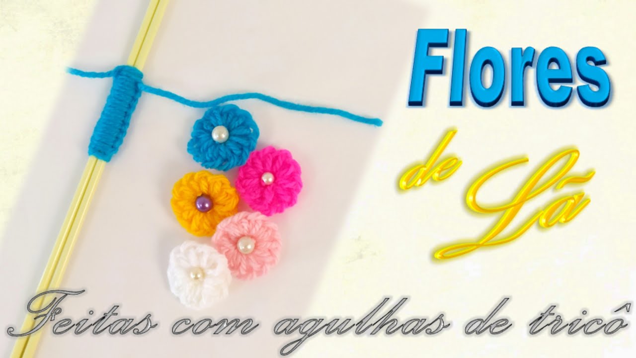 FLORES FEITAS COM AGULHAS E SOBRAS DE LÃ