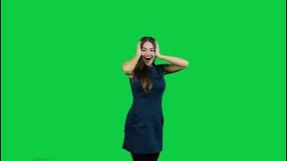 Happy excited girl pointing promoting in front of the green screen