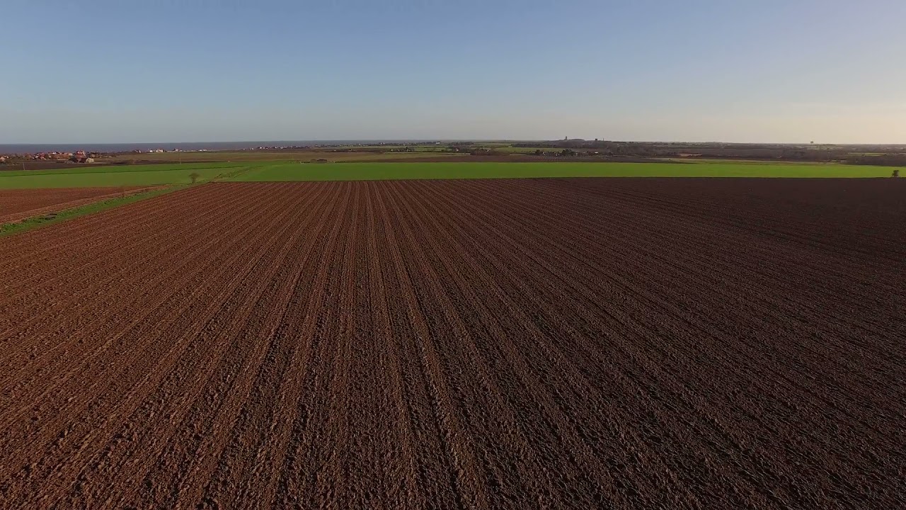 Flying Over Fields (Free Footage, Royalty-Free, and Creative Commons).