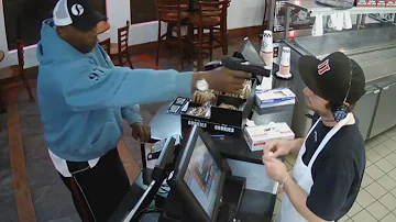 Watch Unfazed Cashier Keep His Cool During Terrifying Gunpoint Robbery