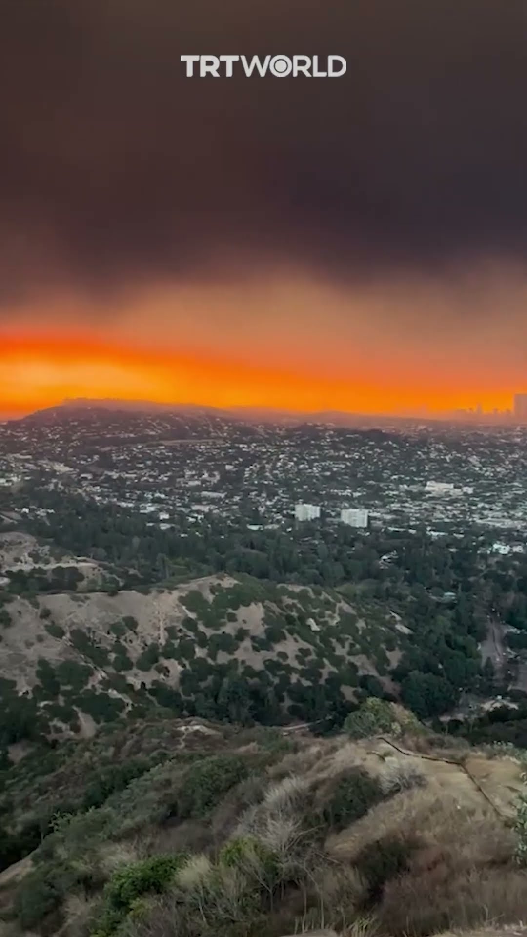 LA skies glow red amid raging wildfires