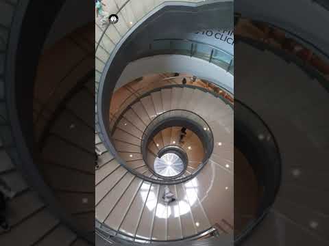 admiring the spiral staircase in Bank Negara Malaysia Museum and Art Gallery.