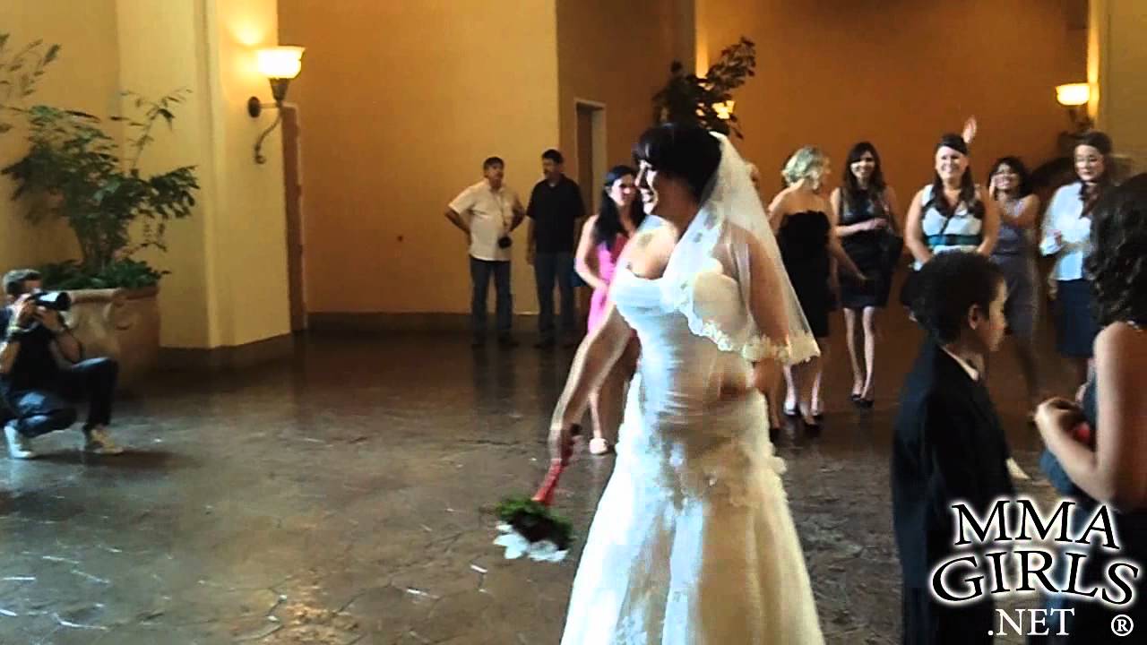 Phil Davis' girlfriend catches the bouquet at Joey Beltran's wedding