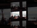 Huge waves crash against a breakwater near Hawaii restaurant