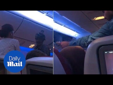 Moment man holds up commercial flight by begging passengers