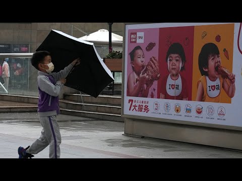 China easing birth limits to allow three-children families