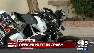 Motorcycle officer hospitalized after north Phoenix crash