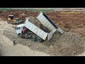 Dozer and dump trucks in action - Strong dump truck unloading stone soil ឡានចាក់ដីខ្លាំង