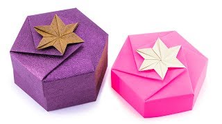 Learn how to make a hexagonal origami box from 1 sheet of paper, no
glue required. these pretty gift boxes can have either hexagon or star
shape on...