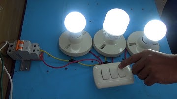 Instalación de tres lamparas/bombillos controlados por un interruptor triple