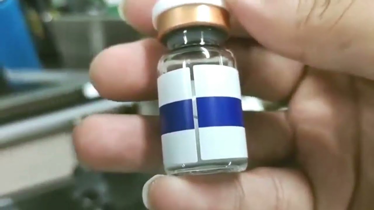 Small bottle positioning labeler equipment