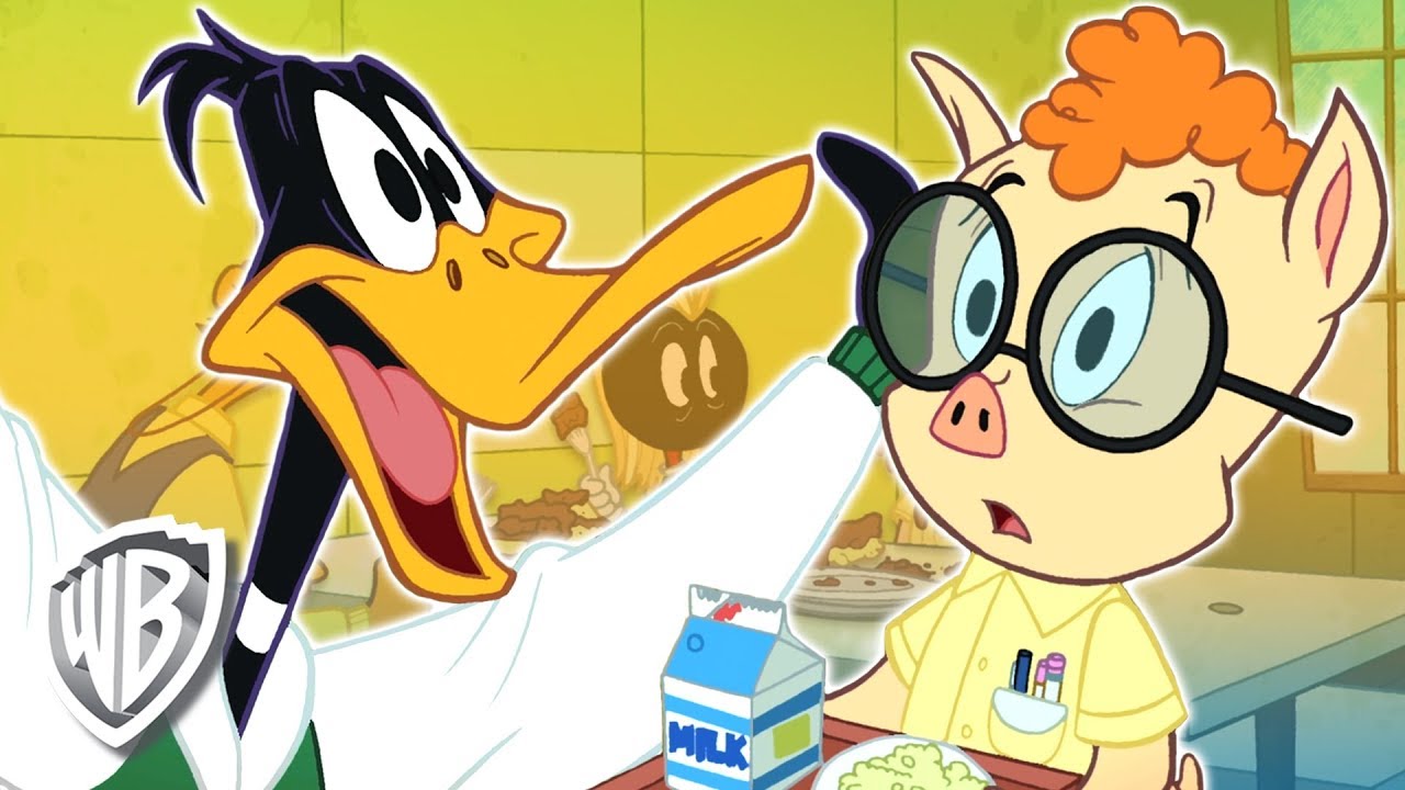 Looney Tunes en Español 🇪🇸 | España | Recuerdos de la escuela secundaria del Pato Lucas | WB Kids