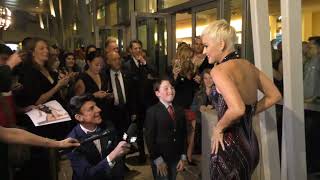 Katy Perry watches Lain Armitage tap dance and do the splits on the Red Carpet