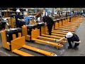 The process of making an electric pallet forklift. Forklift mass production factory in South Korea