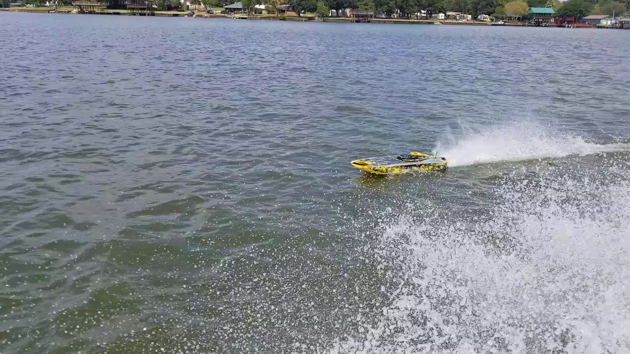 Awesome stunts  at high speed chasing seadoo with the zelos 36 RC boat 