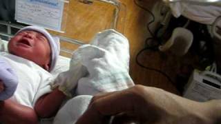 Justin Nieh having diaper changing on his first day.AVI