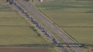 WATCH: LiveCopter 3 shows big rig crashed over overpass on I-5