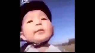 Asian kid falls down a bike with goofy cartoon sounds