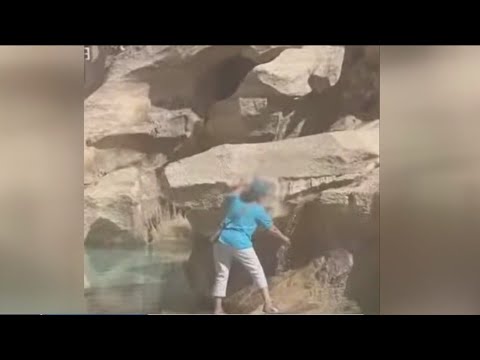 Tourist climbs into Rome's Trevi Fountain to fill up water bottle
