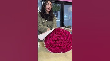 Wrapping a 50 Rose Ramo 🌹💐 #flowers #bouquet #flowerarrangement #florist #bouquetoflove