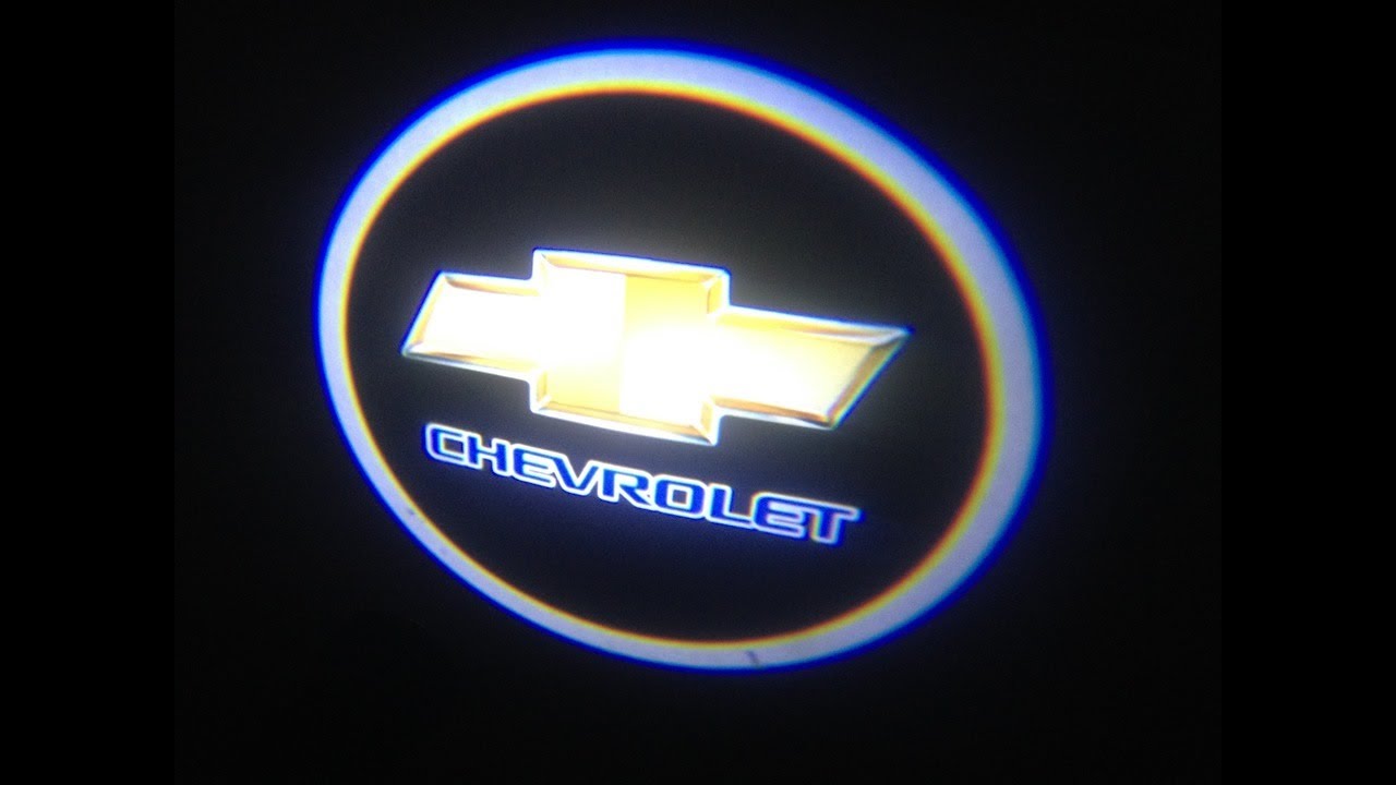 Установка логотипа на магнитолу. Эмблема Chevrolet Captiva. Шевроле Каптива с 100 с эмблемой. Эмблема Шевроле Каптива с 100 передняя подсветкам. Подсветка дверей Шевроле Каптива.