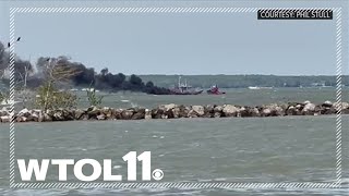 RAW VIDEO: Coast Guard rescues four from burning boat near Catawba Island