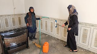 Finishing the whitewashing of grandma's room by operator Hassan