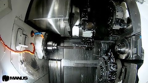 An advanced post processor application on Okuma LT2000 with twin spindle and three turrets