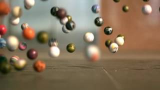 Slow Motion Bouncy Balls Across Floor