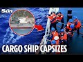 Two dead after Filipino-crewed cargo ship CAPSIZES in disputed South China Sea