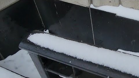 Removing Snow From Decorative Forged Steel HandRail