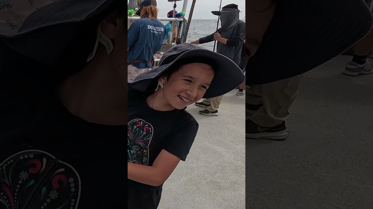 The kid catches his first fish - stoked!