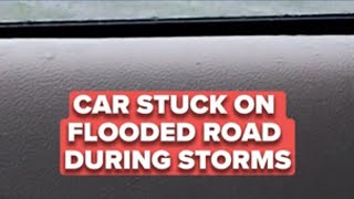Car stuck on flooded road during severe storms in Ashtabula