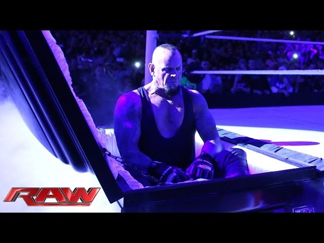 Undertaker rises from a coffin to attack Brock Lesnar: Raw, March 24, 2014 class=