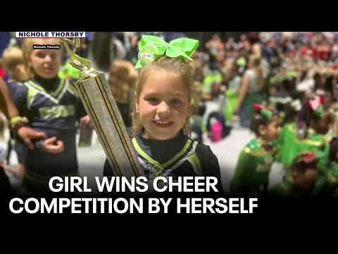 8-year-old girl wins team cheer competition by herself