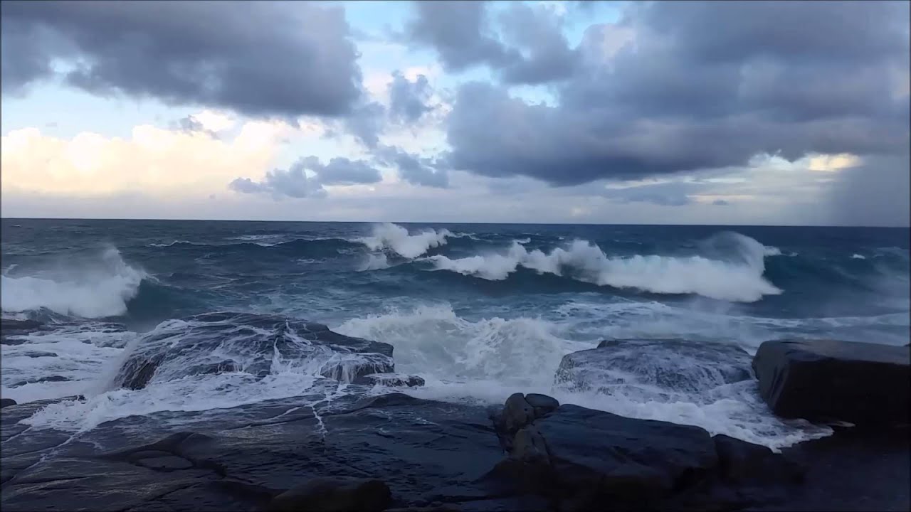 Big waves crashing on rock platform near Fraser Reef Iluka NSW 2466