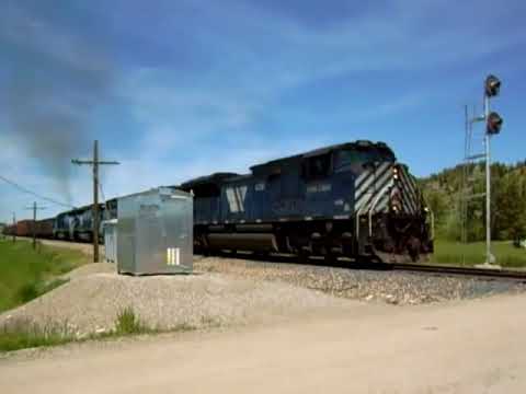 The Missoula to Laurel, or "ML" - Train throttles up to assult the climb up Bozeman Pass. With Two SD70ace's and Two SD45's