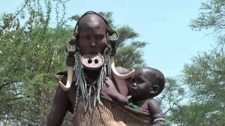 Mursi people - native African tribes in the Omo valley in South of Ethiopia