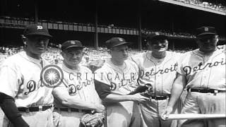 The spectators in a stand watch a baseball match between former players of New Yo...HD Stock Footage