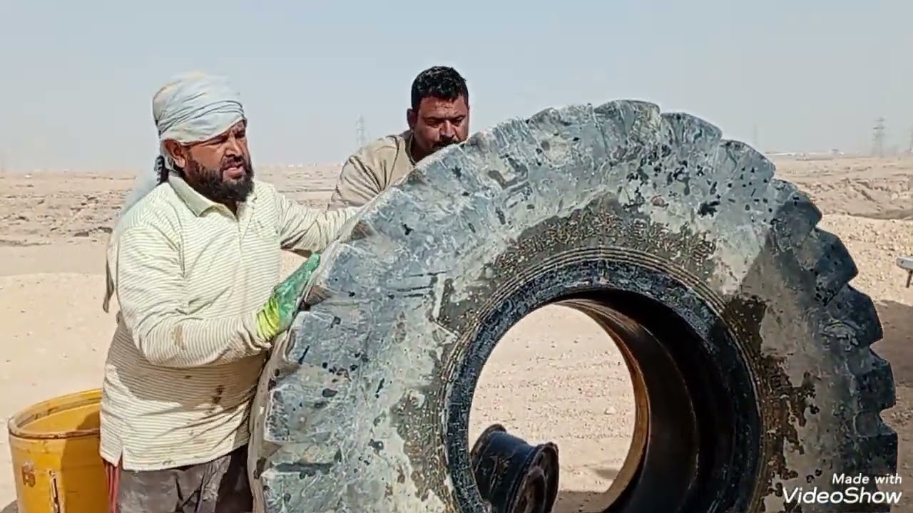 The wheel loader’s tire is being repaired. You can get more information by watching the video
