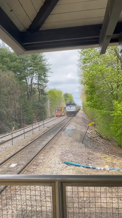 Amtrak Downeaster Flys by Wedgemere as railroad ties are being replaced ...