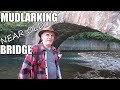 Mudlarking - looking for interesting things in the river near old bridge